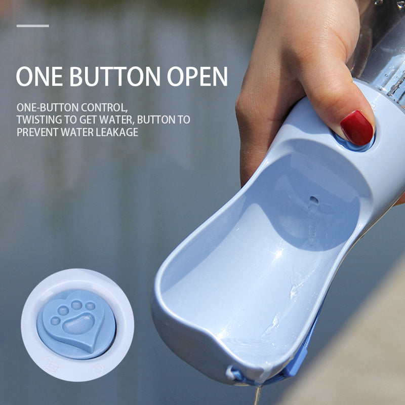 Close-up of blue portable pet water bottle showing the one-button water release