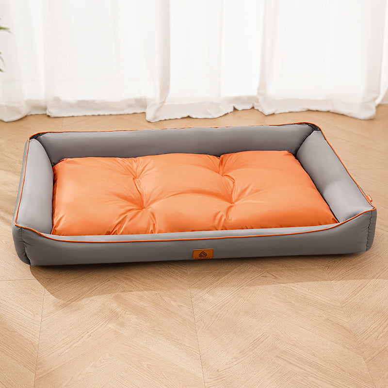 Orange Nomi Nest dog bed with an orange cushion