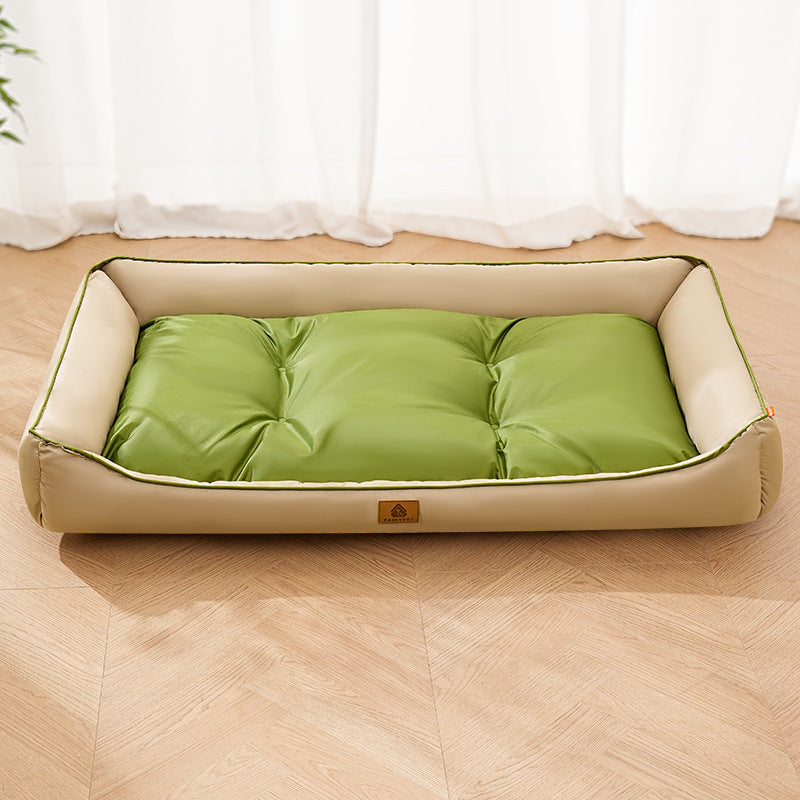 Green Nomi Nest dog bed with a cream cushion